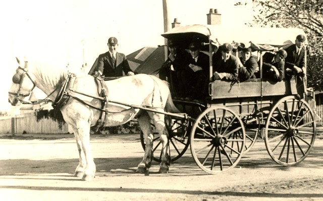 The Chariot, Colonel and the 1st VIII on the way to the Boat Sheds, circa 1921.